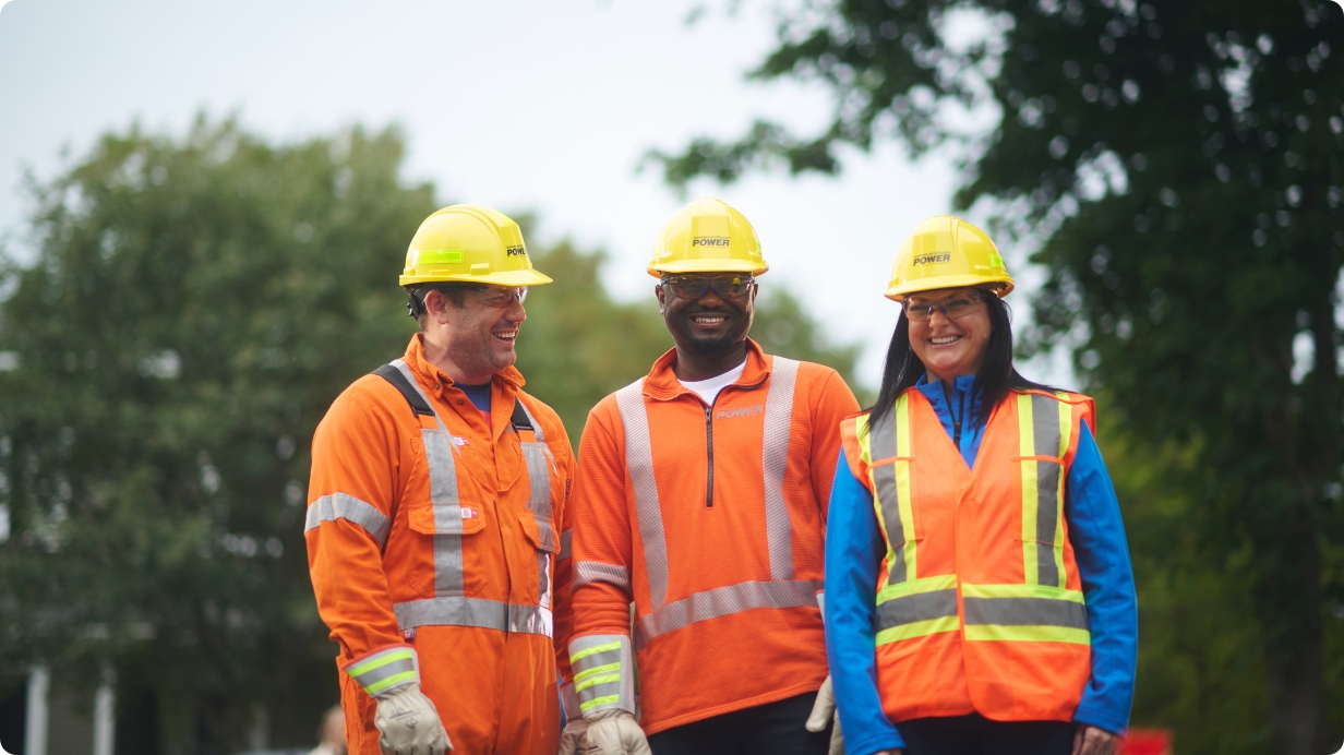 Employee working on power lines in safety gear
